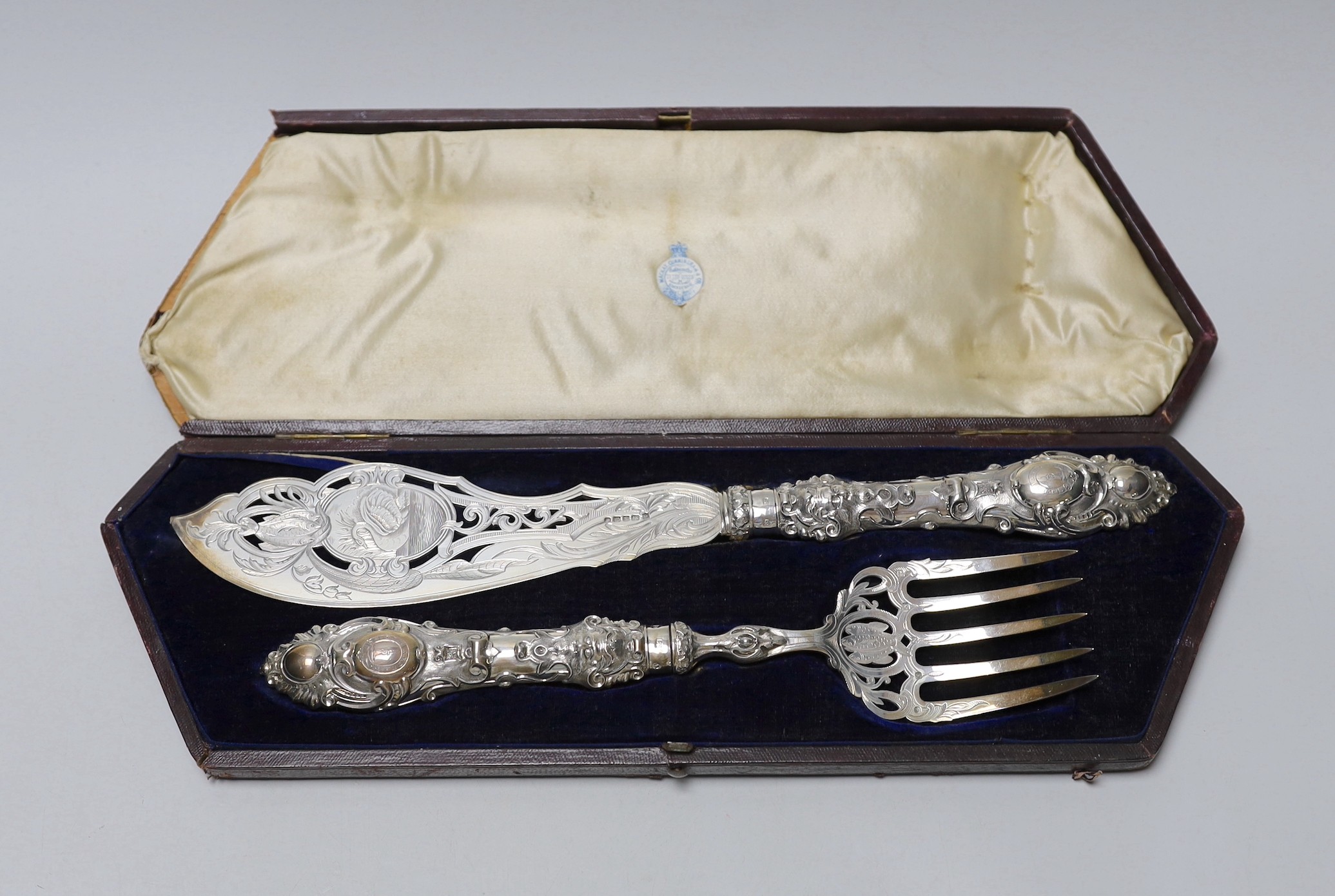 A cased pair of ornate Victorian silver fish servers, Martin, Hall & Co, Sheffield, 1856, knife 35.8cm.